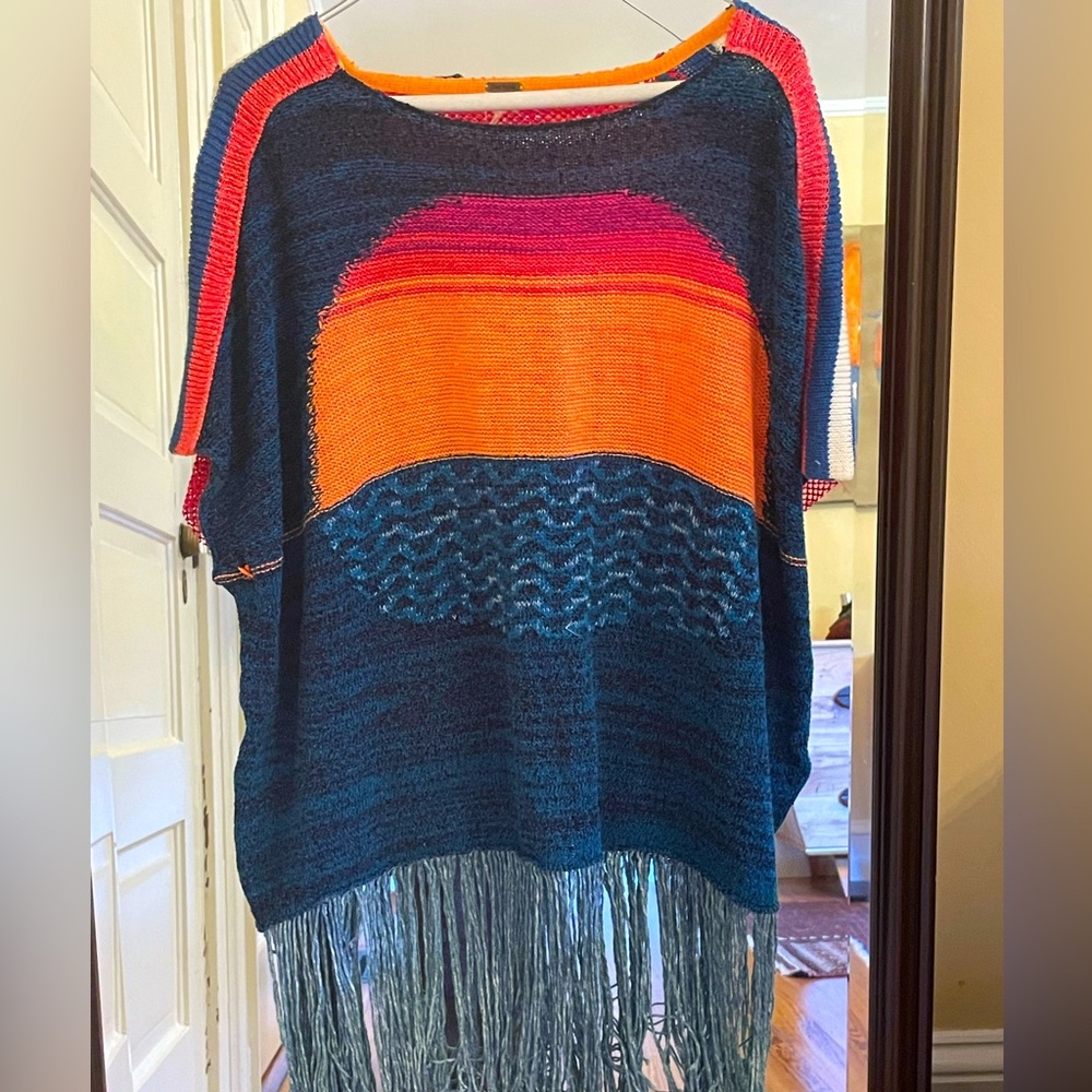 Free People brightly colored poncho with fringe